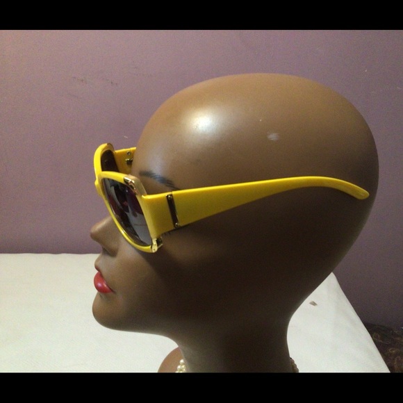 2 pairs of yellow and hot pink sun glasses. - Picture 2 of 9